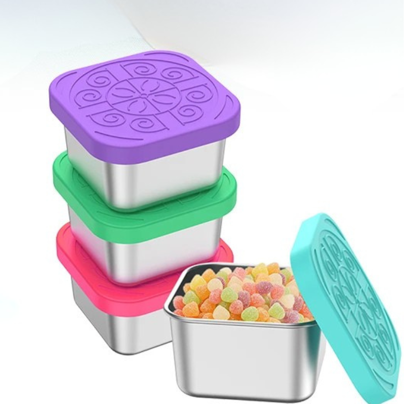 Set of square stainless steel containers with colorful silicone lids on a white background.