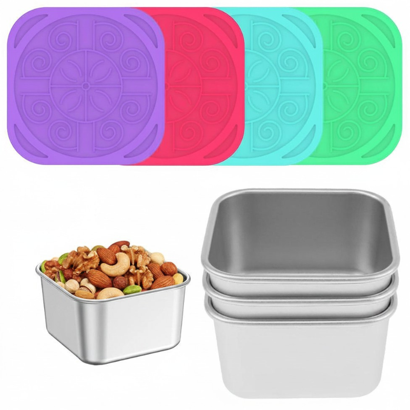 Set of metal food containers with colorful silicone lids on a white background